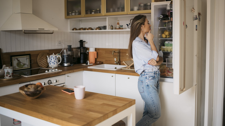 woman looking into the refrigerator