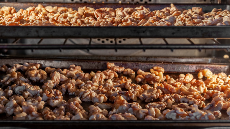 roasting walnuts on a baking sheet in the oven