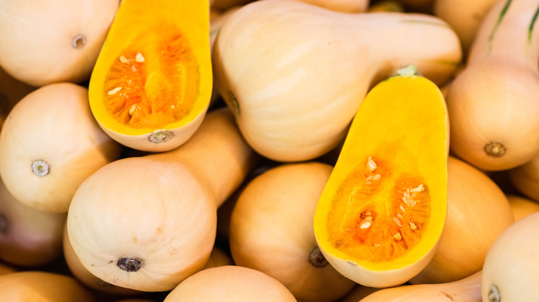 Halved raw honeynut squash