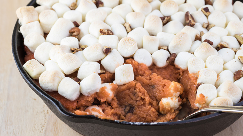 Sweet potato casserole being spooned