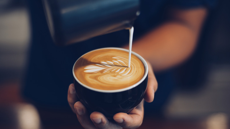 barista making latte 