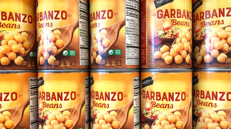 Canned garbanzo beans on a shelf
