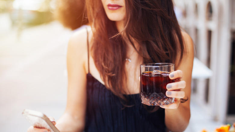 woman drinking cold brew