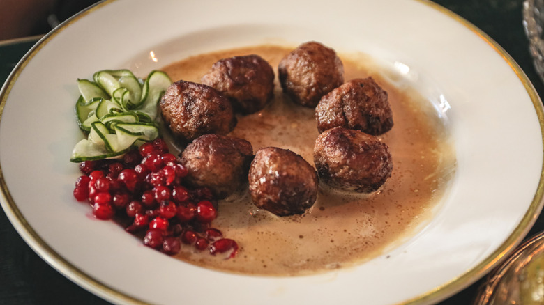 Plate of swedish meatballs with fresh lingonberries