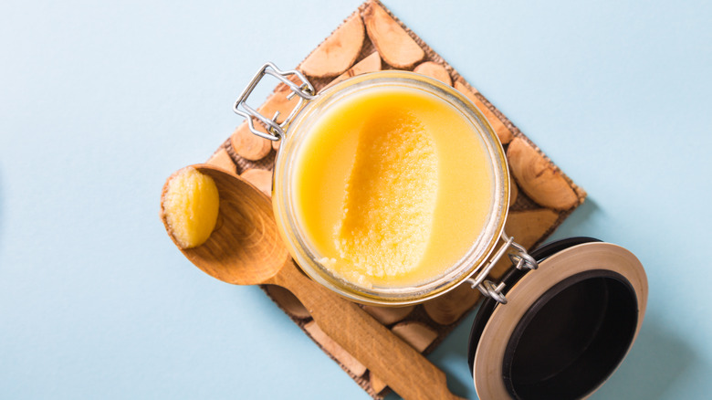 jar of clarified butter with spoon