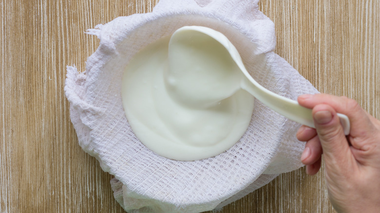 greek yogurt being strained