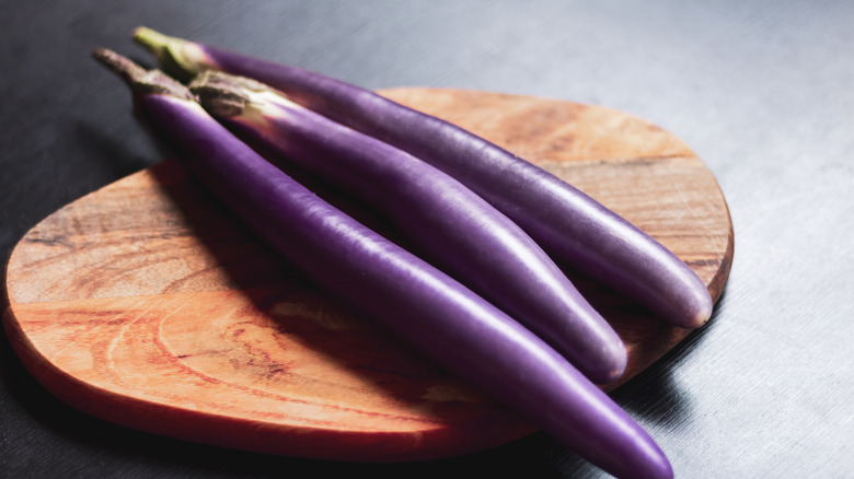 Japanese eggplant on cutting board