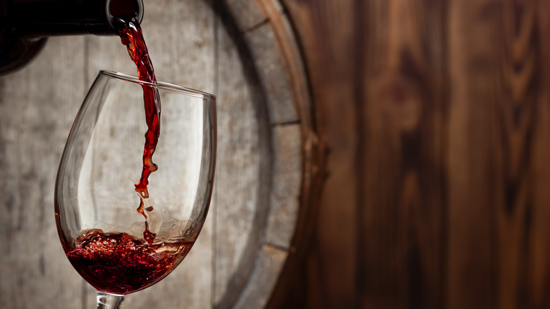 red wine being poured into glass