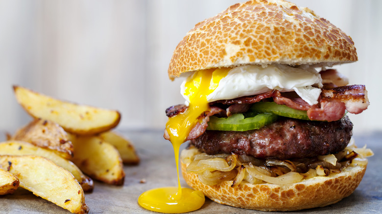 Egg yolk running on burger