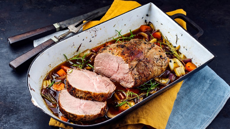 Boneless roast pork tenderloin in casserole with vegetables