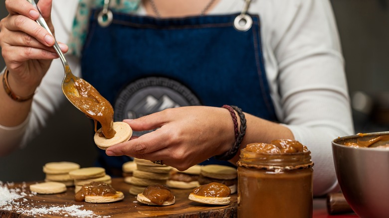 Woman making alfajores