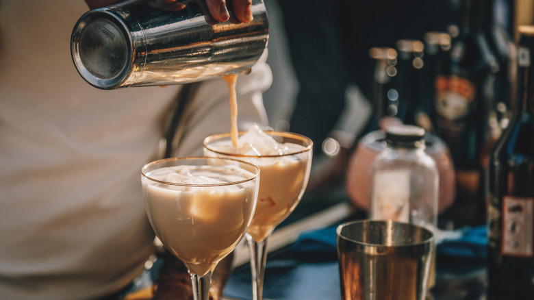 person making cocktails with Irish cream