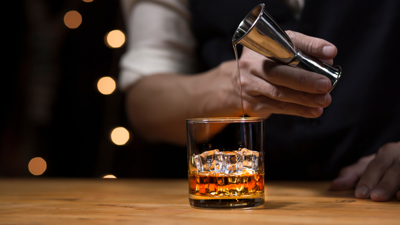 Pouring a glass of bourbon