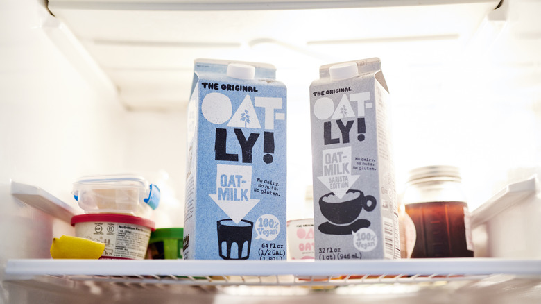 Cartons of oat milk in fridge