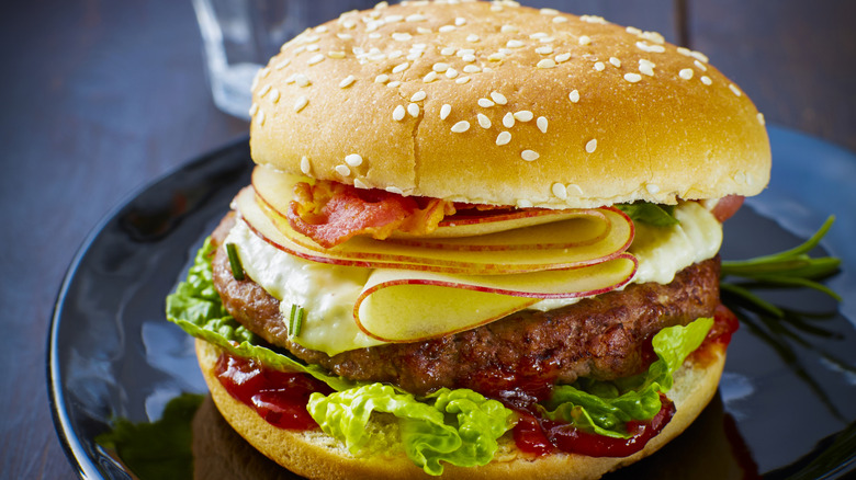 Burger with an apple slice