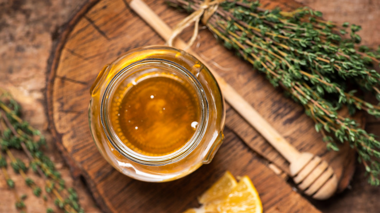 thyme and jar of honey