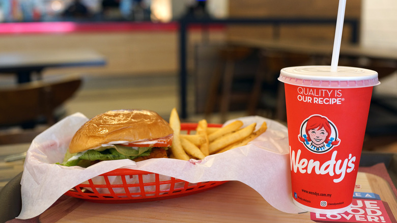 Wendy's burger, fries, and beverage on a table