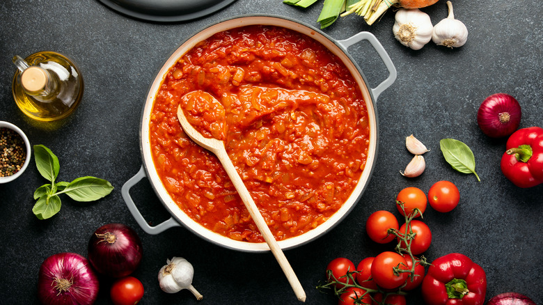 Tomato sauce surrounded by ingredients