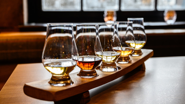 tasting glasses filled with whiskey