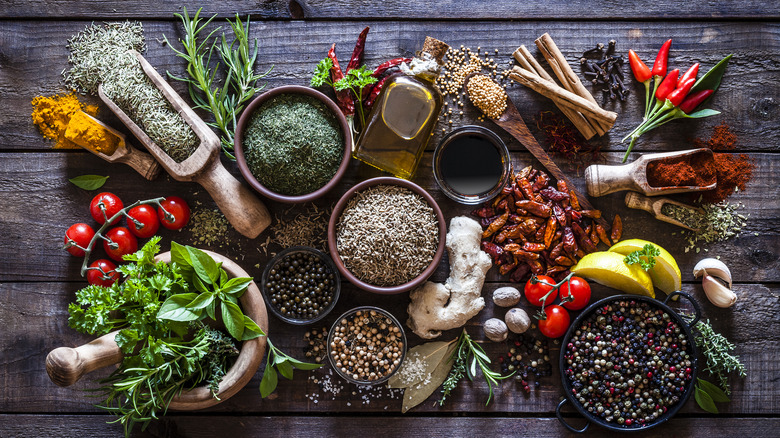 wooden table full of aromatic ingredients