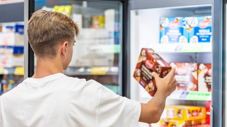 Taking ice cream from freezer section