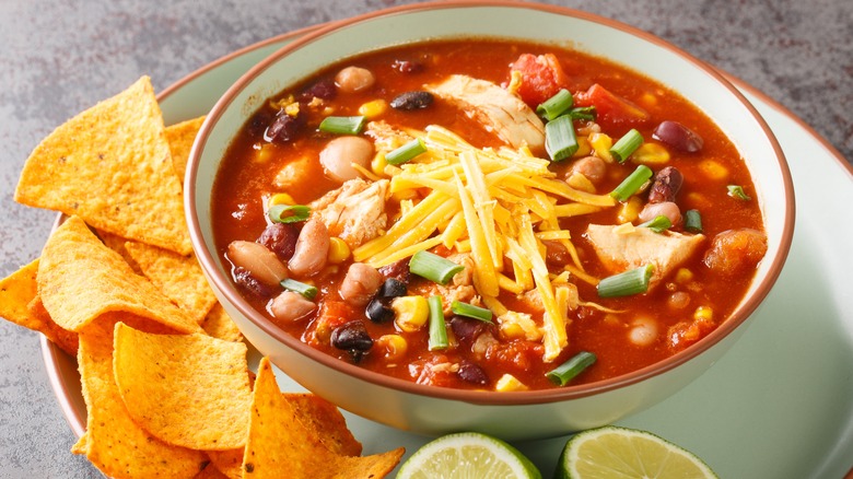 Bowl of chili with tortillas