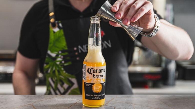 Bartender making Corona-based cocktail