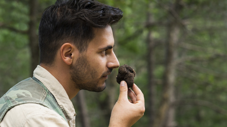 man smelling truffle