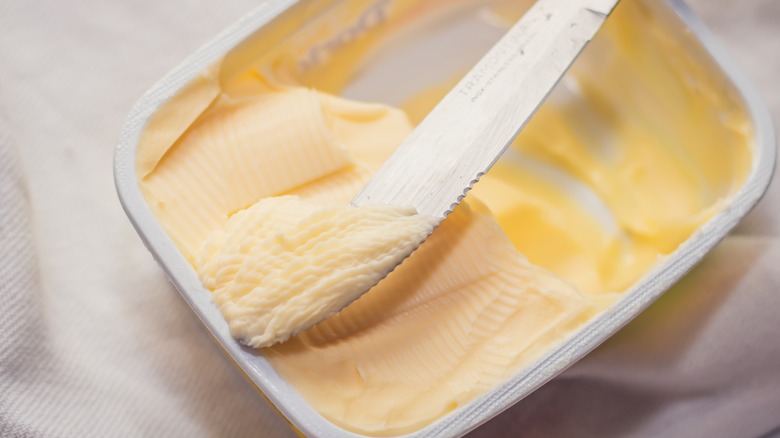 margarine in dish with knife