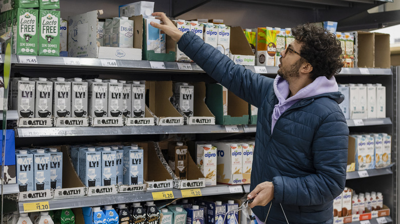 Man shopping for coconut milk