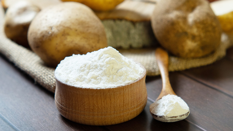 Potato starch in a wooden bowl