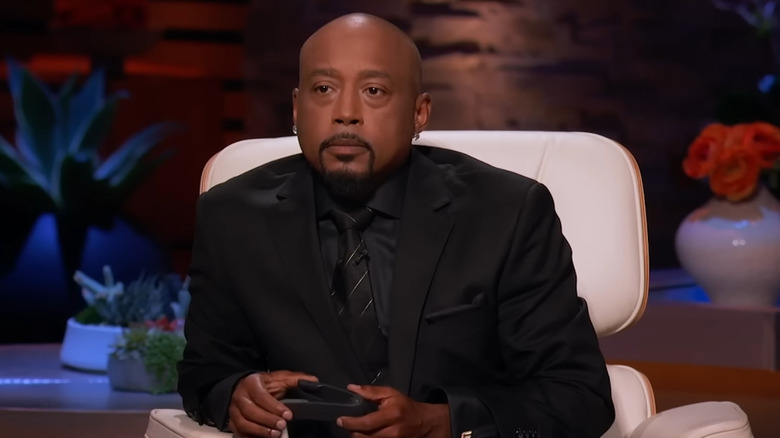 Daymond John holding AnyTongs on Shark Tank