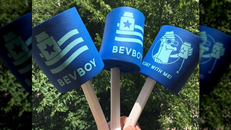 hand holding up BeverageBoy koozies