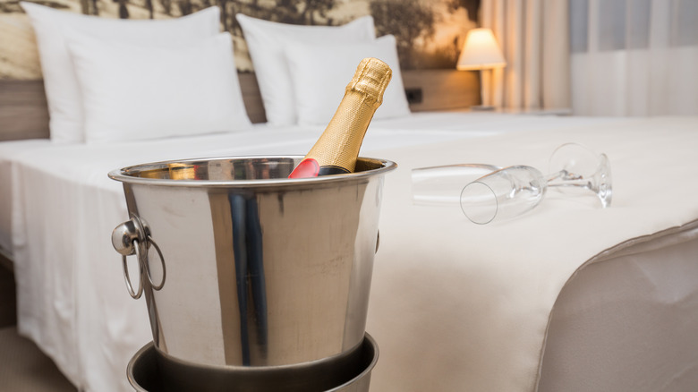 Champagne bucket sitting beside bed