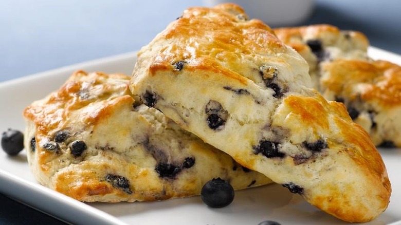 three blueberry scones on plate