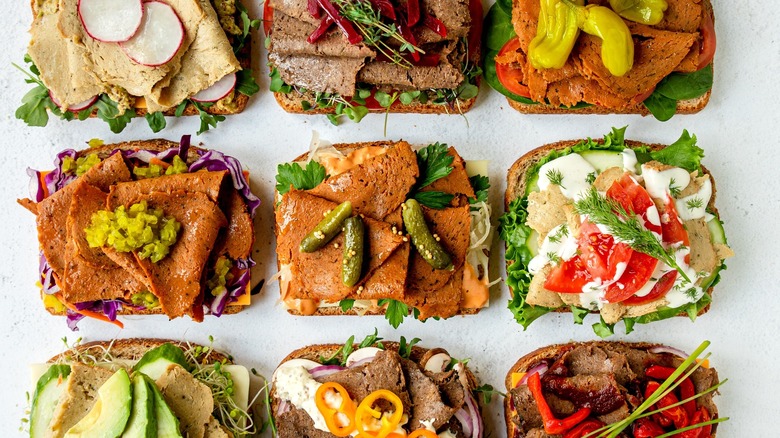 An array of open sandwiches topped with Mrs. Goldfarb's Unreal Deli and other toppings