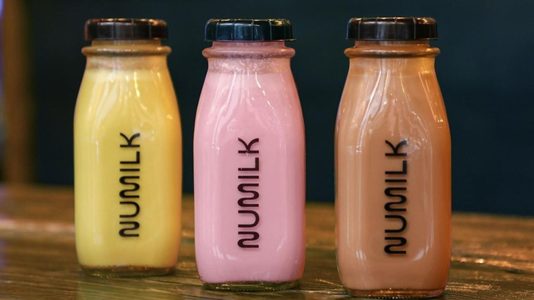 Three glass jars of Numilk