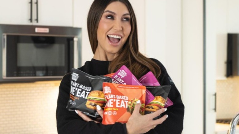 Lindsey Cunningham holds RollinGreens ME'EAT products