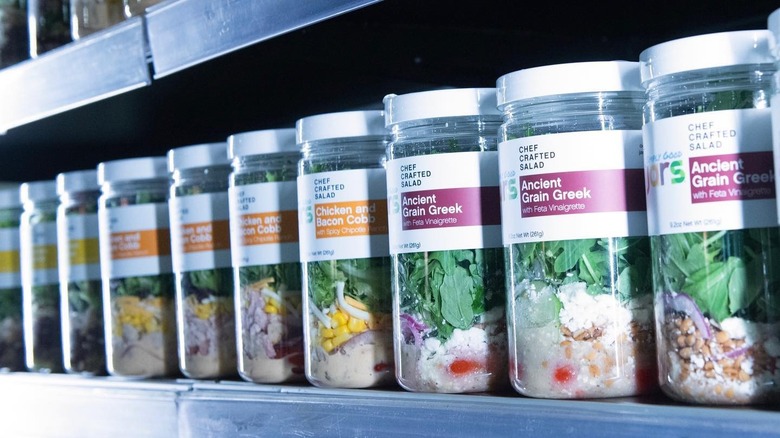 Simply Good Jars lined up in a refrigerator