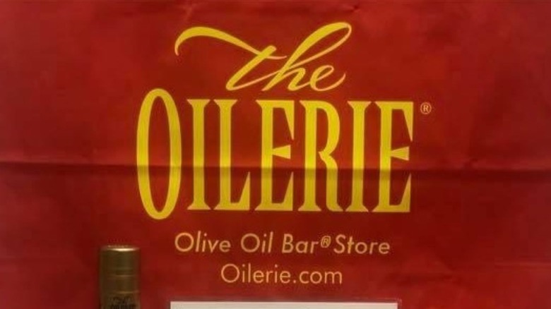 The Oilerie backdrop with bottle