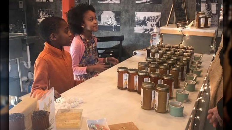 Zach and Zoe selling honey 