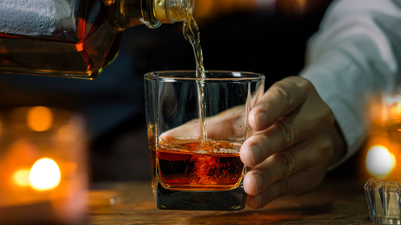 Whiskey poured into glass