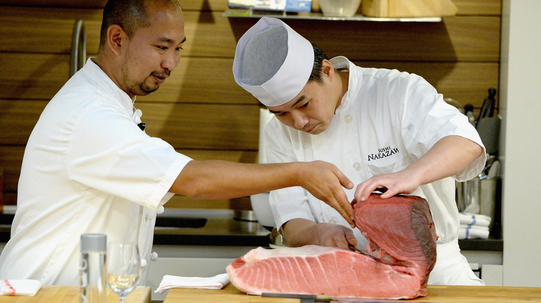 Daisuke Nakazawa prepares fish