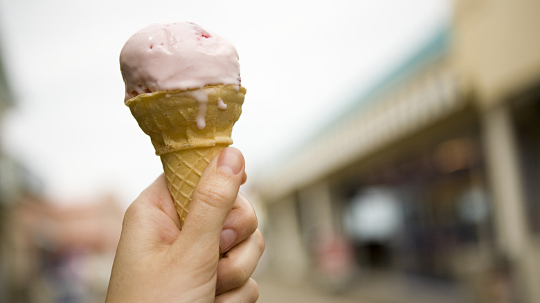 ice cream cone in hand