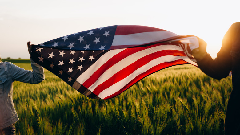 People holding the American flag