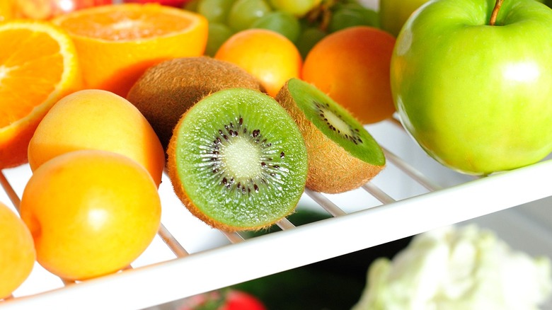 Kiwis and fruit in refrigerator 