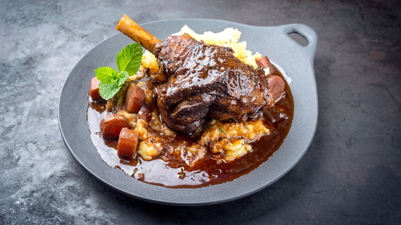 braised lamb shank on potatoes