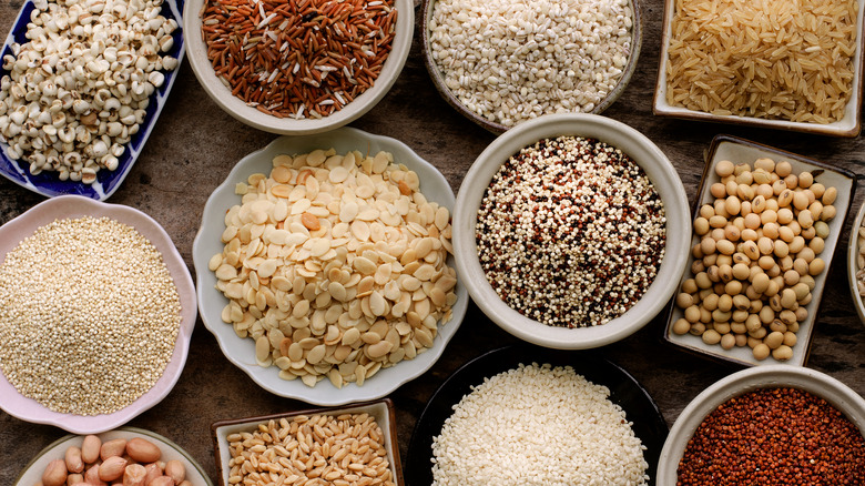 Bowls of quinoa, brown rice, wild rice, and other grains 