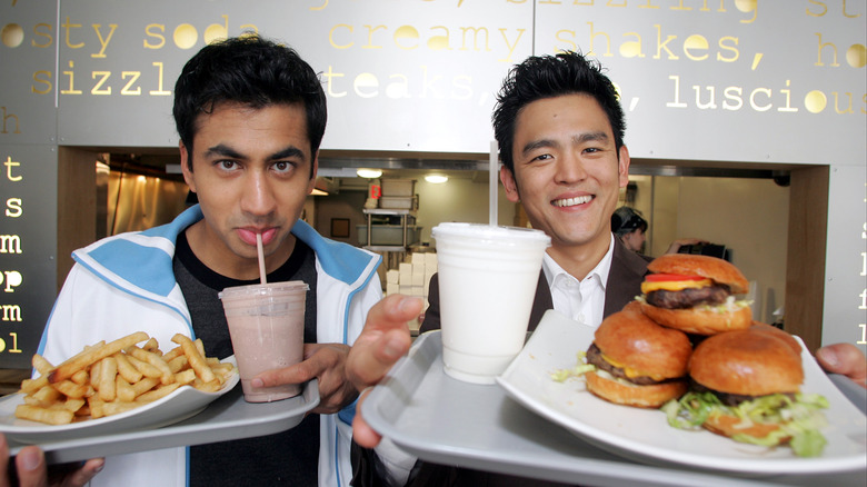 John Cho and Kal Penn holding food