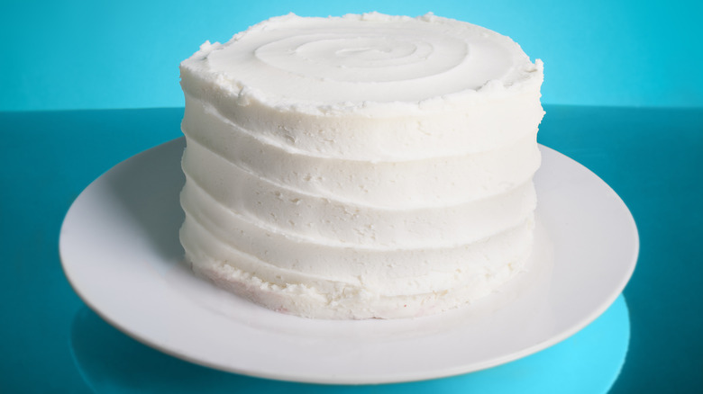 White cake against blue background